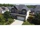 Aerial view of the house, highlighting the roof, landscaping, and location within the neighborhood at 125 Durban Meadow Dr, Holly Springs, NC 27540