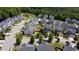 Aerial view of the house, showing the community, landscaping, and nearby pond at 125 Durban Meadow Dr, Holly Springs, NC 27540