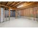 Spacious unfinished basement with concrete floor and exposed ceiling, ready for customization at 125 Durban Meadow Dr, Holly Springs, NC 27540