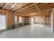 Unfinished basement ready for customization, featuring exposed beams and ample space at 125 Durban Meadow Dr, Holly Springs, NC 27540