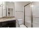 Clean bathroom with granite countertop, framed mirror, glass enclosed shower, and toilet at 125 Durban Meadow Dr, Holly Springs, NC 27540