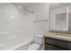 Bathroom featuring granite counters, dark wood cabinets, and a shower-tub combination at 125 Durban Meadow Dr, Holly Springs, NC 27540