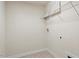 Practical laundry room with wire shelving and utility hookups, designed for convenience at 125 Durban Meadow Dr, Holly Springs, NC 27540