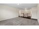 Spacious loft area with carpet and hardwood floors, with natural light and open layout at 125 Durban Meadow Dr, Holly Springs, NC 27540