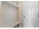 Convenient mudroom with built-in bench, hooks, and storage, perfect for organization at 125 Durban Meadow Dr, Holly Springs, NC 27540