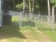 View of the chain link fence surrounding the property at 125 Tast Dr, Wendell, NC 27591