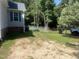 View of the side yard and the chain link fence surrounding the property at 125 Tast Dr, Wendell, NC 27591