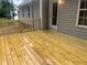 Recently built deck with natural stain and access to a fenced backyard at 125 Tast Dr, Wendell, NC 27591