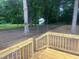 Recently built deck with natural stain and access to a fenced backyard with mature trees at 125 Tast Dr, Wendell, NC 27591