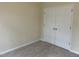 A neutral-toned bedroom with closet, carpet, and ample natural light at 125 Tast Dr, Wendell, NC 27591