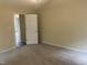 Bedroom with neutral carpet and trim. The door leads to another bedroom or closet at 125 Tast Dr, Wendell, NC 27591