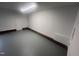 This is an interior view of a spacious, clean garage with painted floors and trim at 125 Tast Dr, Wendell, NC 27591