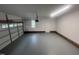 This is an inside view of a spacious garage with a freshly painted floor at 125 Tast Dr, Wendell, NC 27591