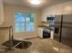 A kitchen with stainless-steel appliances, granite counters, and a double sink at 125 Tast Dr, Wendell, NC 27591