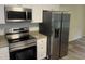 The kitchen shows stainless steel appliances, granite countertops, and white cabinets at 125 Tast Dr, Wendell, NC 27591