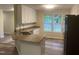 Kitchen with stainless-steel appliances, granite counters, island sink, and subway-tile backsplash at 125 Tast Dr, Wendell, NC 27591