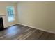 A living room with wood flooring, a fireplace, light-yellow paint and a window at 125 Tast Dr, Wendell, NC 27591