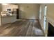 Open-concept kitchen and living room with wood flooring and stainless-steel appliances at 125 Tast Dr, Wendell, NC 27591