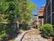 Secluded backyard view with lush greenery, a small stream, and mature trees at 129 Grande Dr, Morrisville, NC 27560
