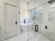 Bright bathroom featuring a freestanding tub, glass shower, and modern finishes; a total spa-like experience at 129 Grande Dr, Morrisville, NC 27560
