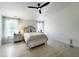 Serene bedroom with a large bed, soft lighting, and neutral decor; cozy and inviting at 129 Grande Dr, Morrisville, NC 27560