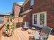 Cozy backyard deck with seating and potted plants, ideal for relaxation and outdoor enjoyment at 129 Grande Dr, Morrisville, NC 27560
