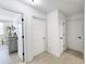Bright hallway featuring white doors with black hardware and light hardwood floors at 129 Grande Dr, Morrisville, NC 27560