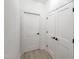 Clean hallway featuring neutral paint, modern doors and stylish black hardware at 129 Grande Dr, Morrisville, NC 27560