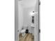 A compact bathroom features a pedestal sink and toilet, all in a clean, modern design at 1534 Millrock Trl, Wendell, NC 27591