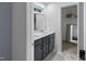 This contemporary bathroom features double sinks and a walk-in closet space at 1534 Millrock Trl, Wendell, NC 27591