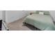 A simple bedroom features neutral carpet, a window, and a bed frame at 1534 Millrock Trl, Wendell, NC 27591