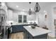 Modern kitchen with an island, stainless steel appliances, and sleek finishes for a functional space at 1534 Millrock Trl, Wendell, NC 27591