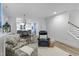Open-concept space with living, dining, and kitchen areas with lots of natural light and modern decor at 1534 Millrock Trl, Wendell, NC 27591