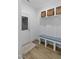 Mudroom area with built-in storage bench and shelves near the door, providing organization for the Gathering at 1534 Millrock Trl, Wendell, NC 27591