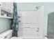 Bright bathroom showcasing a pristine white tub and shower combination at 1826 Northgate St, Durham, NC 27704