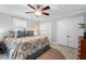 Bedroom with a large bed, botanical print bedspread, and ample storage to ensure a relaxing and organized space at 1826 Northgate St, Durham, NC 27704