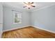 Cozy bedroom with hardwood floors and a window, creating a bright and welcoming space for relaxation at 1826 Northgate St, Durham, NC 27704