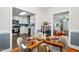 Dining area that flows seamlessly into a modern kitchen with stainless steel appliances at 1826 Northgate St, Durham, NC 27704
