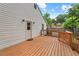 Exterior angle of home, from wood deck with door entrance, under sunny sky at 1826 Northgate St, Durham, NC 27704