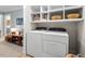 Well-equipped laundry room with ample shelving above modern appliances, offering practical storage at 1826 Northgate St, Durham, NC 27704