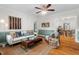 Bright living room featuring beautiful hardwood floors and stylish decor open to dining room at 1826 Northgate St, Durham, NC 27704