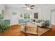 Stylish living room with hardwood floors and plenty of natural light from large windows and a door at 1826 Northgate St, Durham, NC 27704