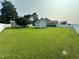 A storage shed sits in the backyard, surrounded by the home's perimeter fence at 202 Camelia Dr, Princeton, NC 27569