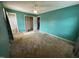 Bright bedroom features green walls, ceiling fan and a standard closet at 202 Camelia Dr, Princeton, NC 27569