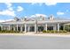 Beautiful amenity center with a covered walkway, lush landscaping and attractive architectural details at 209 Sage Oak Ln, Holly Springs, NC 27540