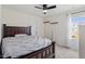 Cozy bedroom with a large bed, neutral decor, and natural light from the window at 209 Sage Oak Ln, Holly Springs, NC 27540