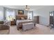 Comfortable bedroom with ceiling fan, two windows, and nice furniture at 209 Sage Oak Ln, Holly Springs, NC 27540