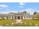 Elegant clubhouse with white columns, manicured landscaping, and a welcoming entrance at 209 Sage Oak Ln, Holly Springs, NC 27540