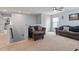 Upstairs living area with comfortable seating and natural light, perfect for relaxation at 209 Sage Oak Ln, Holly Springs, NC 27540