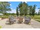 Inviting outdoor fire pit area with comfortable seating for gatherings at 209 Sage Oak Ln, Holly Springs, NC 27540